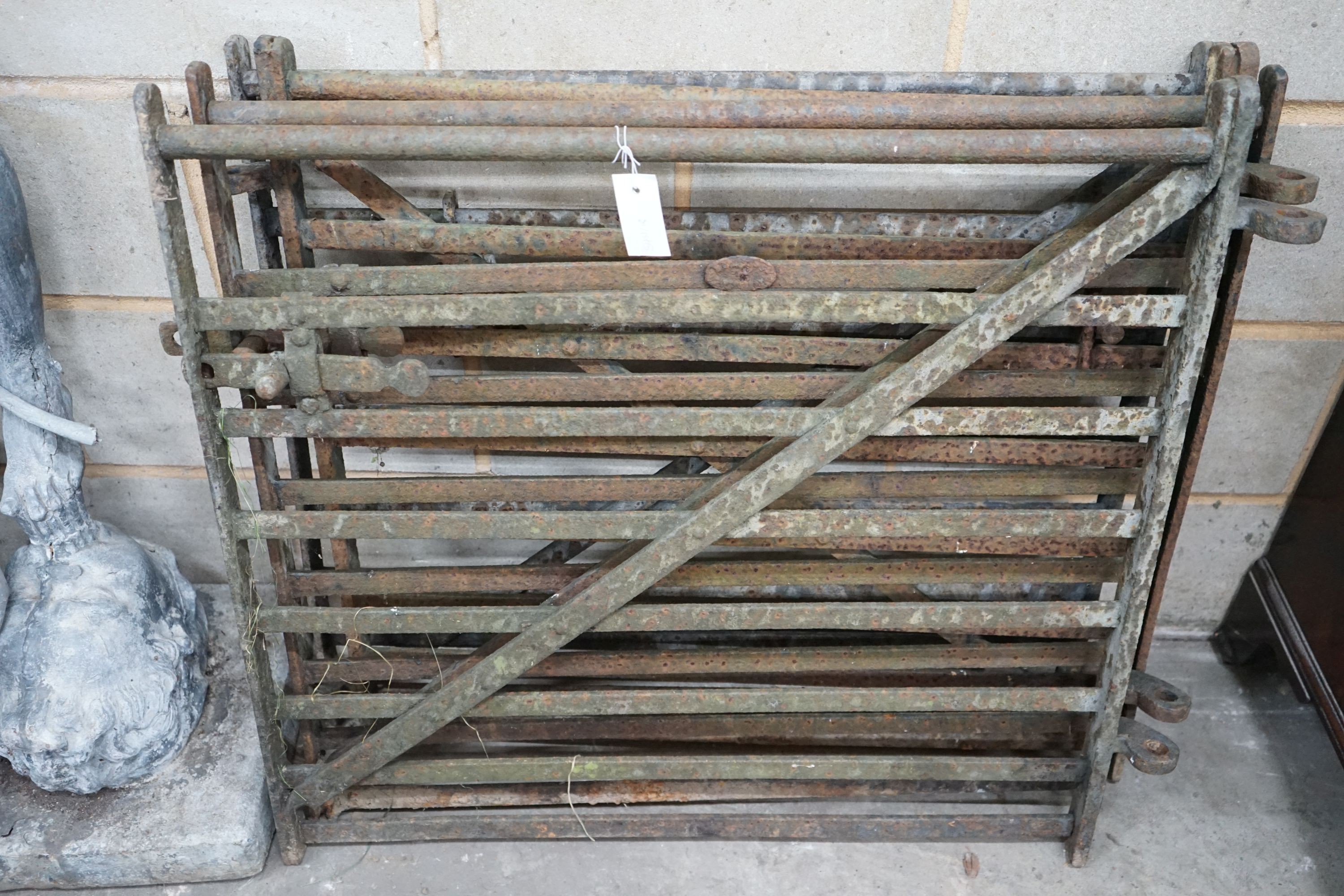 A set of four wrought iron garden gates, width 84cm, height 80cm